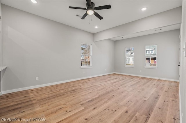 empty room featuring visible vents, recessed lighting, light wood-style floors, baseboards, and ceiling fan