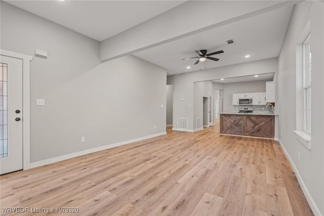 unfurnished living room featuring a ceiling fan, baseboards, visible vents, recessed lighting, and light wood-type flooring