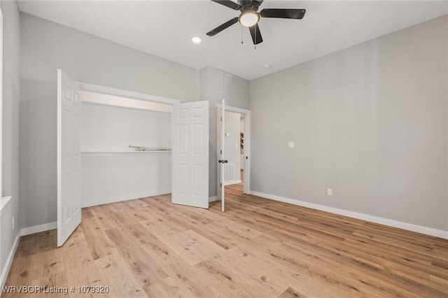 unfurnished bedroom with light wood finished floors, a closet, and baseboards