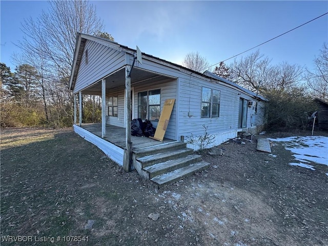 view of front of home featuring covered porch