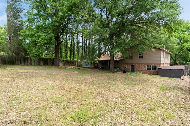 view of yard with a fenced backyard