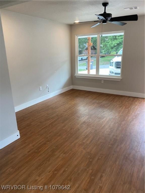 518 N Coker St Unit A & B, Greenwood, AR 72936 - empty room featuring visible vents, baseboards, wood finished floors, and a ceiling fan