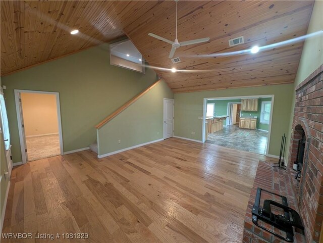 1385 Old Airport Rd, Paris, AR 72855 - unfurnished living room with wood ceiling, light wood-style floors, baseboards, a brick fireplace, and a ceiling fan