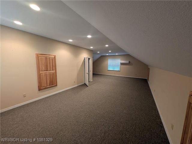 1385 Old Airport Rd, Paris, AR 72855 - bonus room featuring vaulted ceiling, baseboards, recessed lighting, carpet flooring, and a textured ceiling