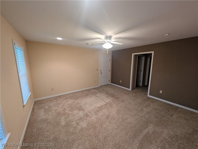 1385 Old Airport Rd, Paris, AR 72855 - spare room featuring a ceiling fan, carpet floors, and baseboards