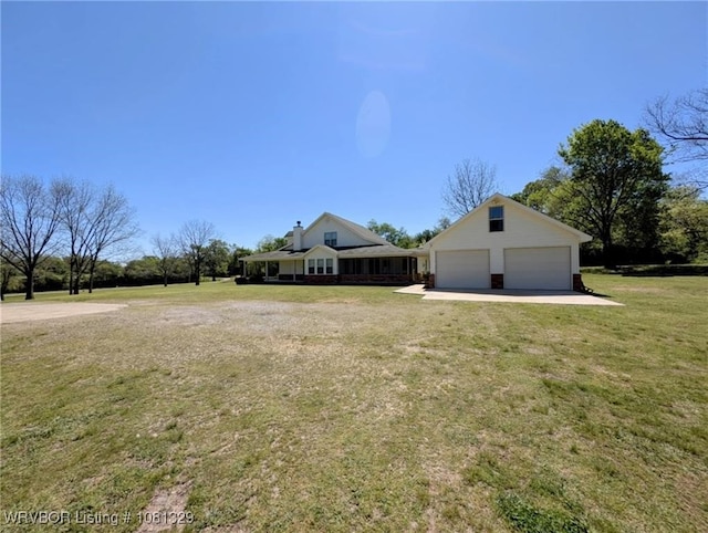 1385 Old Airport Rd, Paris, AR 72855 - view of green lawn with a garage and an outdoor structure