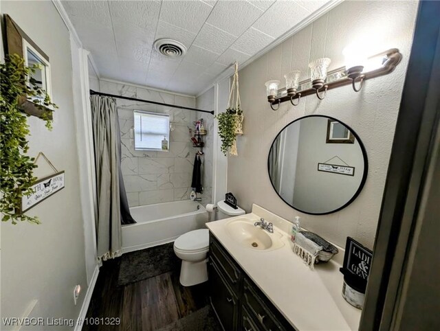 1385 Old Airport Rd, Paris, AR 72855 - bathroom featuring wood finished floors, vanity, shower / tub combo, toilet, and crown molding