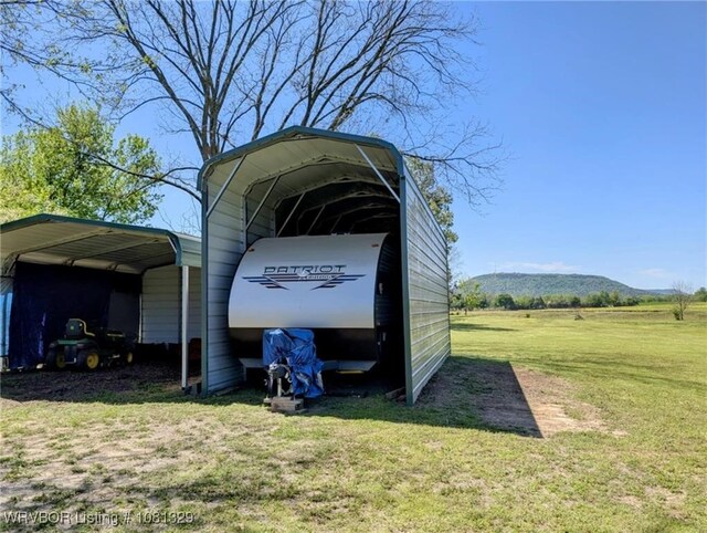 1385 Old Airport Rd, Paris, AR 72855 - view of parking with a detached carport and a mountain view