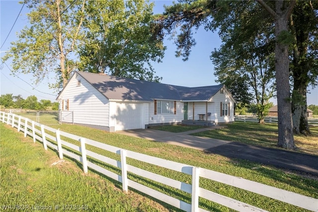 view of front facade with a garage and a front lawn