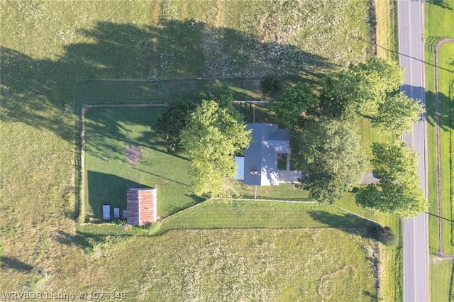 birds eye view of property with a rural view