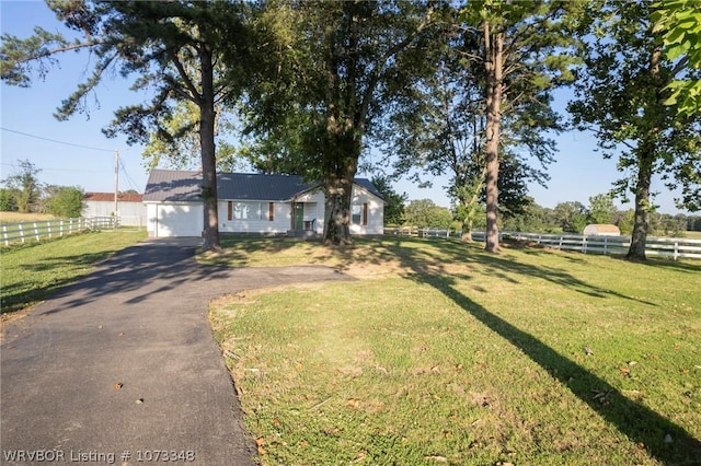 ranch-style home with a front lawn