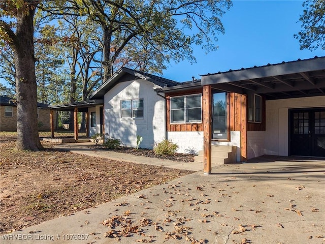 exterior space with a carport