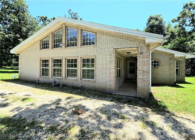 20222 Garman Rd, Gentry, AR 72734 - view of front of property featuring brick siding, a front lawn, and a patio