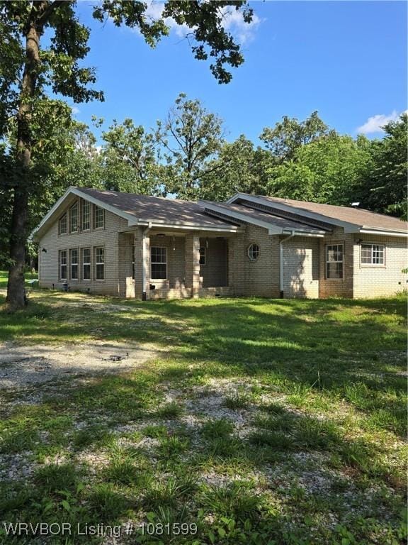 20222 Garman Rd, Gentry, AR 72734 - back of house with brick siding and a lawn