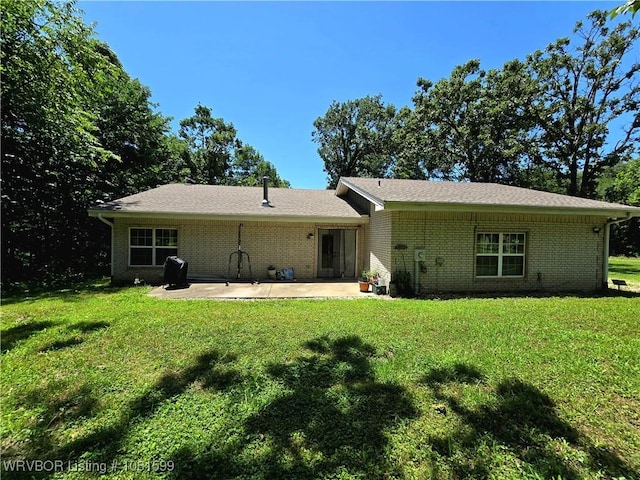 20222 Garman Rd, Gentry, AR 72734 - back of house featuring a patio area, brick siding, and a lawn