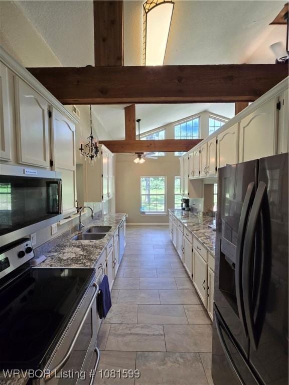 20222 Garman Rd, Gentry, AR 72734 - kitchen featuring stainless steel appliances, beam ceiling, light stone countertops, white cabinets, and a chandelier