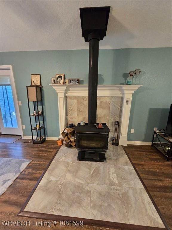 20222 Garman Rd, Gentry, AR 72734 - detailed view of a wood stove and baseboards