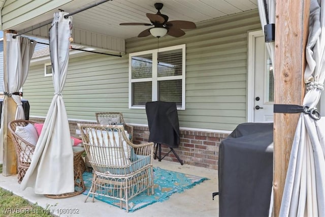 view of patio featuring grilling area and a ceiling fan