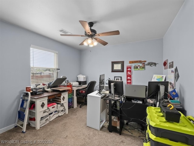 office area with ceiling fan, carpet flooring, and visible vents