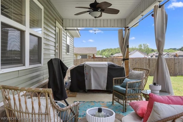 view of patio / terrace featuring grilling area, fence, and ceiling fan