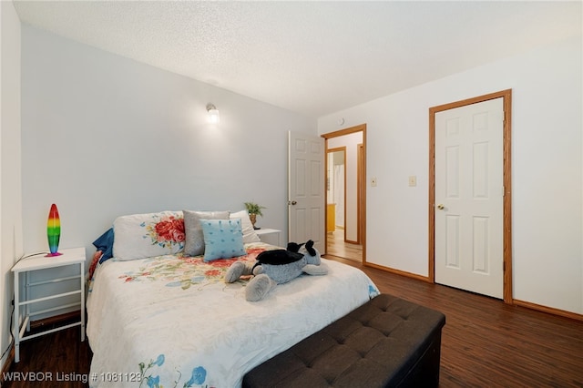175 Sulphur City Rd, Fayetteville, AR 72701 - bedroom featuring wood finished floors, baseboards, and a textured ceiling