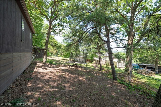 175 Sulphur City Rd, Fayetteville, AR 72701 - view of yard featuring a trampoline