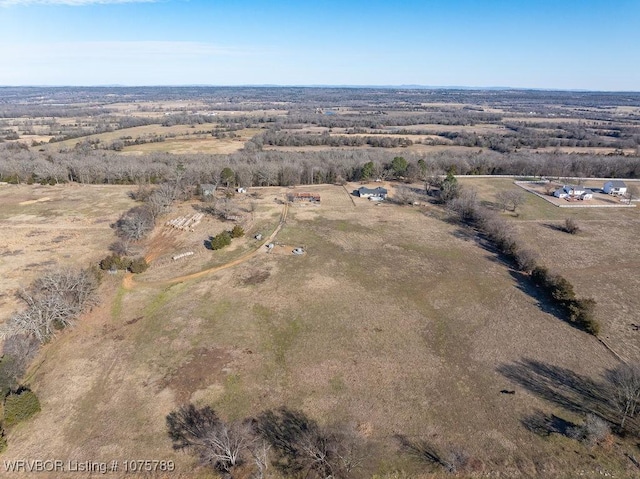 birds eye view of property featuring a rural view