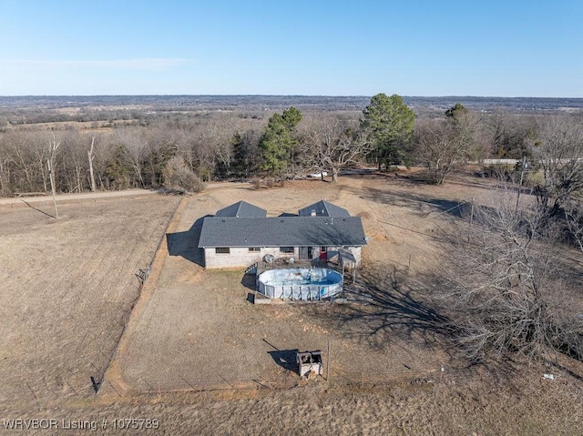 birds eye view of property with a rural view