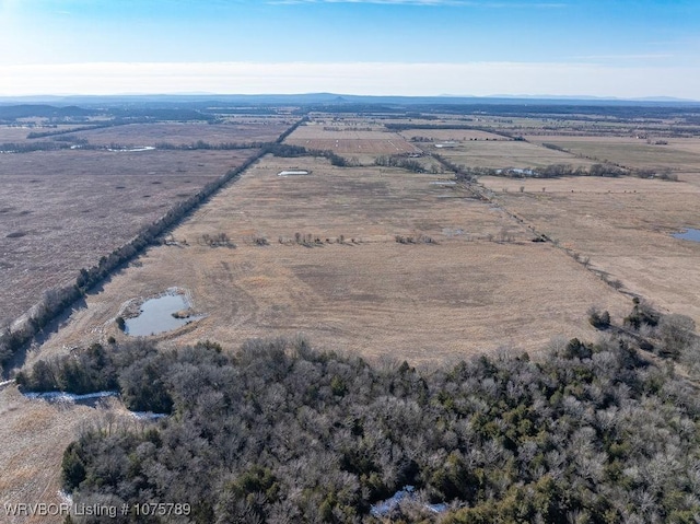 birds eye view of property with a rural view