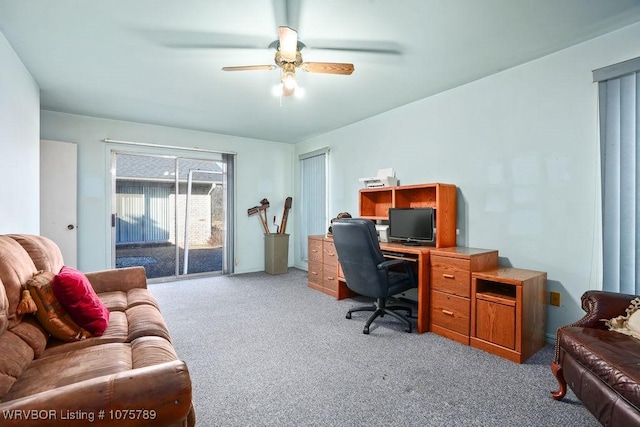 office with light carpet and ceiling fan