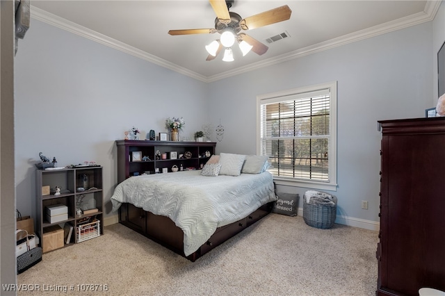 carpeted bedroom featuring crown molding and ceiling fan