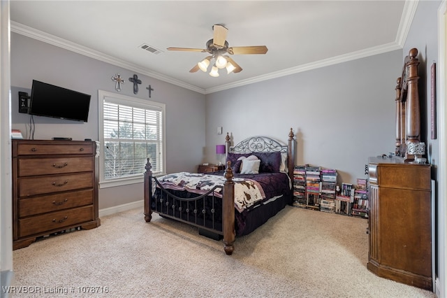 bedroom featuring crown molding, light colored carpet, and ceiling fan