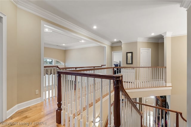 corridor with crown molding and light hardwood / wood-style floors