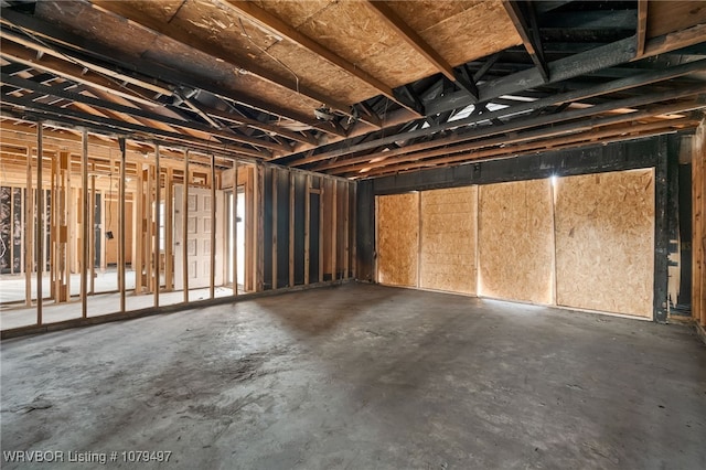 misc room with unfinished concrete floors