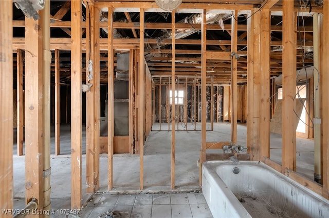 full bath featuring a tub to relax in