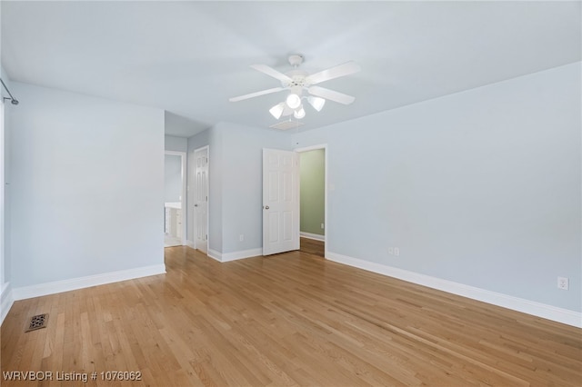 empty room featuring light hardwood / wood-style flooring and ceiling fan