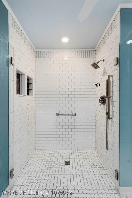 bathroom featuring a shower with shower door