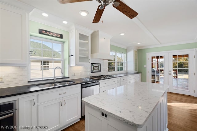 kitchen featuring white cabinetry, stainless steel appliances, sink, and french doors