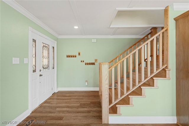 foyer featuring hardwood / wood-style flooring and ornamental molding