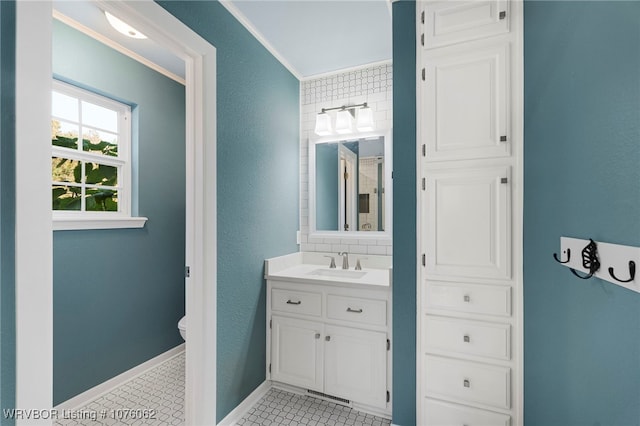 bathroom with tile patterned floors, vanity, toilet, and backsplash