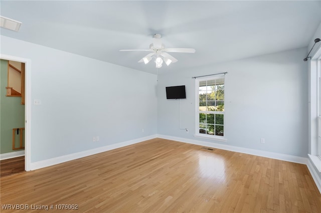 unfurnished room featuring ceiling fan and light hardwood / wood-style flooring