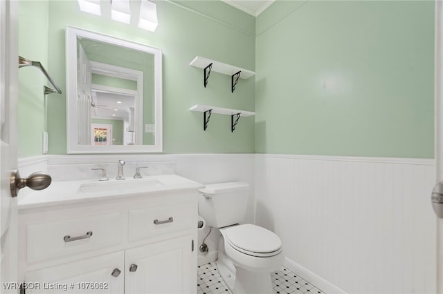 bathroom with tile patterned floors, vanity, and toilet