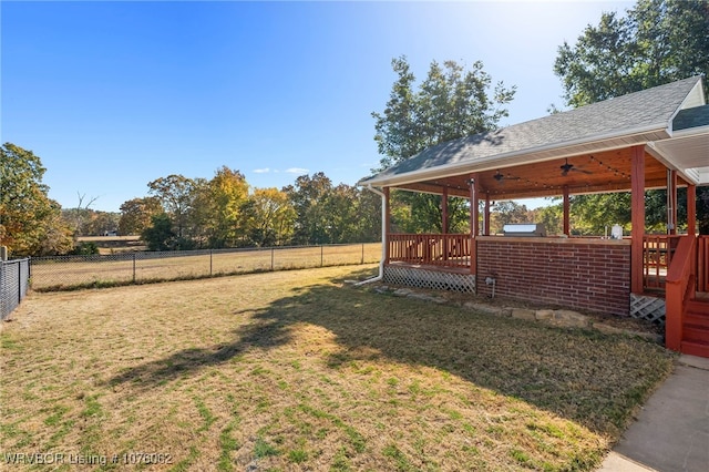 view of yard featuring ceiling fan