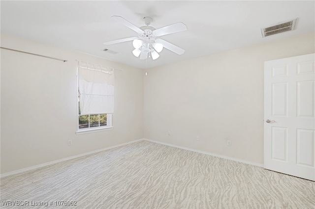 carpeted empty room with ceiling fan