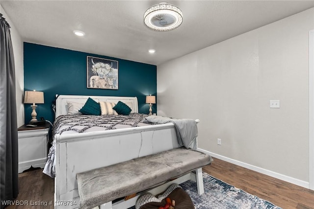 bedroom featuring recessed lighting, baseboards, and wood finished floors