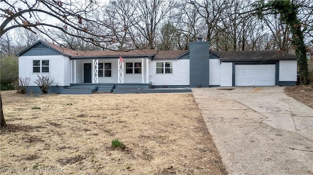 ranch-style house featuring a garage and a porch