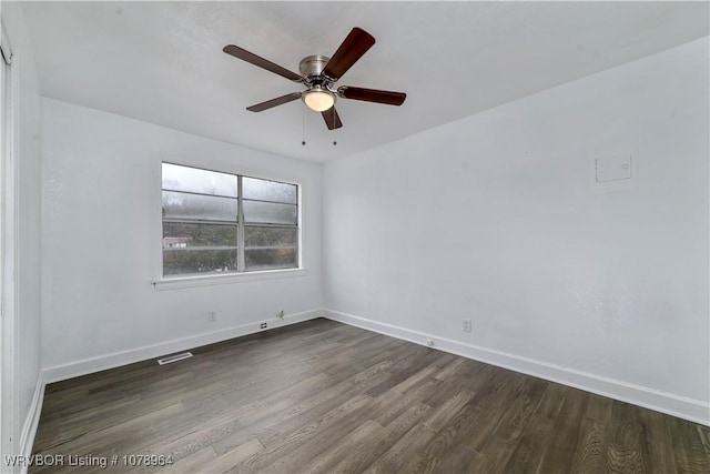 unfurnished room featuring dark hardwood / wood-style floors and ceiling fan