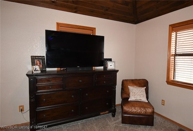 sitting room featuring vaulted ceiling and light carpet