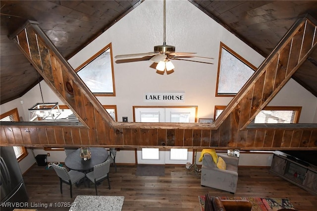 interior space featuring crown molding, dark wood-type flooring, high vaulted ceiling, wooden ceiling, and french doors