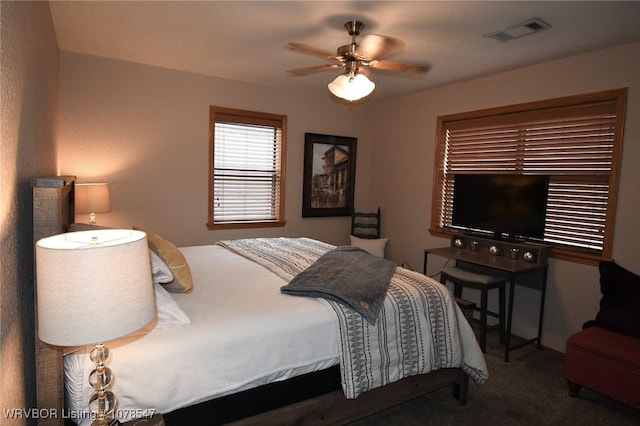 carpeted bedroom with ceiling fan